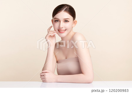 Beautiful young asian woman with clean fresh skin on beige background, Face care, Facial treatment, Cosmetology, beauty and spa, Asian women portrait. Beautiful young asian woman with clean fresh skin on beige background, Face care, Facial treatment, Cosmetology, beauty and spa, Asian women portrait. 120200983