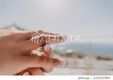 Closeup of a Hand With a Diamond Ring 120201064