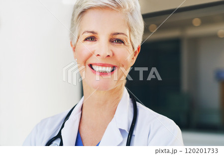 Smiling is the universal language of kindness. Cropped portrait of a mature healthcare professional standing in her uniform and smiling while indoors during the day. Smiling is the universal language of kindness. Cropped portrait of a mature healthcare professional standing in her uniform and smiling while indoors during the day. 120201733