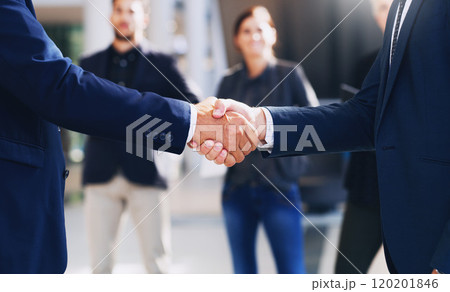 Congratulations, lets do this. Cropped shot of two unrecognizable businesspeople shaking hands while in the office during the day. Congratulations, lets do this. Cropped shot of two unrecognizable businesspeople shaking hands while in the office during the day. 120201846