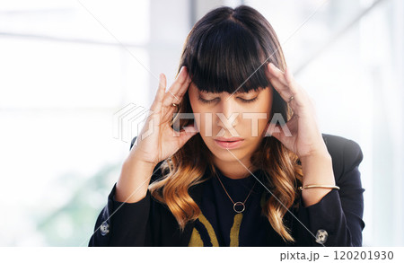 The battle of burnout. Shot of a young businesswoman experiencing stress while working in a modern office. 120201930