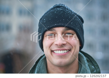 No one more handsome than a hero. Shot of a young soldier standing outside on a snowy day at military school. 120202137
