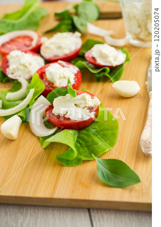 tomato wedges with cottage cheese filling and garlic, spicy appetizer 120205074