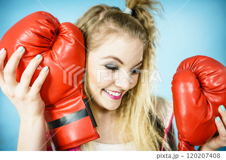 Funny girl with red gloves playing sports boxing 120207408