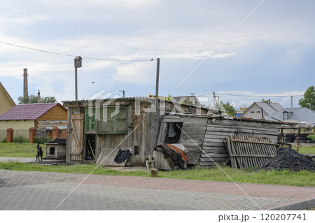 An old wooden barn, a dovecote, dogs with kennels and a birdhouse in Barabinsk, Russia An old wooden barn, a dovecote, dogs with kennels and a birdhouse in Barabinsk, Russia 120207741