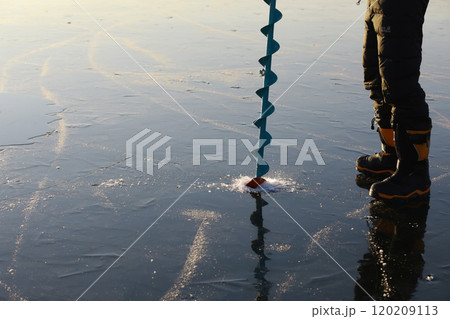 Ice ax - ice screws on winter fishing on the ice caves. Ice is very clean and beautiful. The Lake Baikal. 120209113