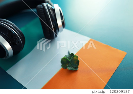 Saint patrick's day background with ireland flag. Religious Christian holiday. Four-leaf clover symbol of good luck. 120209187