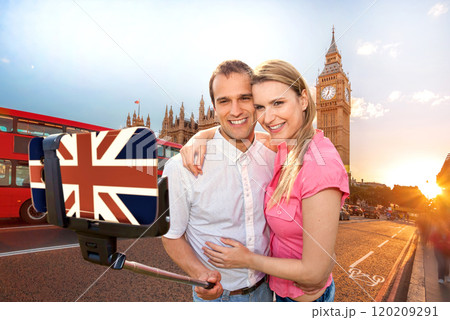 Couple in love taking a selfie portrait in front of Big Ben on their way around Westminster in London, England 120209291