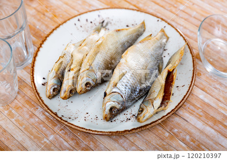 Dried roaches served on wooden table 120210397