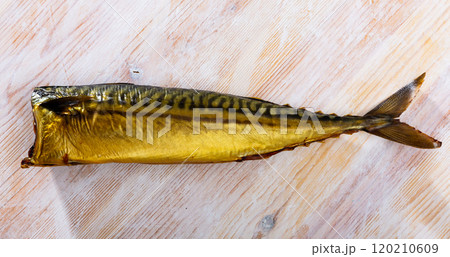 Smoked mackerel on wooden background 120210609