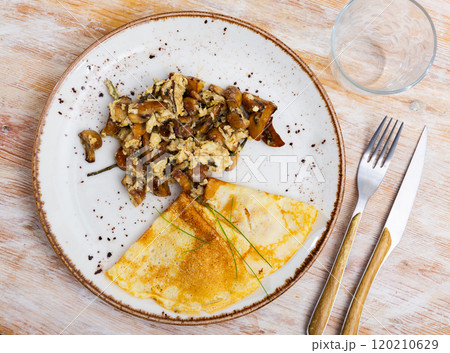 Omelette with mushrooms and asparagus served with pancakes Omelette with mushrooms and asparagus served with pancakes 120210629