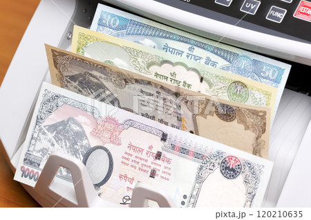 Nepalese rupee in the counting machine Nepalese rupee in the counting machine 120210635