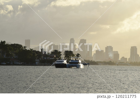 Luxury yacht and houses at the canal in Miami Beach Luxury yacht and houses at the canal in Miami Beach 120211775
