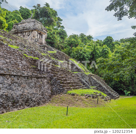 The ancient pyramids of Palenque in Mexico, surrounded by lush jungle. Iconic archaeological site showcasing Mayan culture and history. Travel, history, and adventure concept The ancient pyramids of Palenque in Mexico, surrounded by lush jungle. Iconic archaeological site showcasing Mayan culture and history. Travel, history, and adventure concept 120212354
