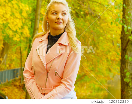 Fashion woman walking in autumn park Fashion woman walking in autumn park 120212839