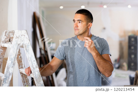 Portrait of a concentrated young man Portrait of a concentrated young man 120213454