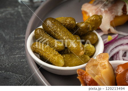 Pickled cucumbers in salty appetizer plate Pickled cucumbers in salty appetizer plate 120213494