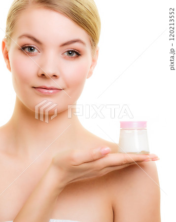 Skin care. Girl applying moisturizing cream. 120213552