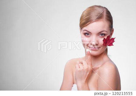 Skin care. Face of young woman girl with red maple leaf. Skin care. Face of young woman girl with red maple leaf. 120213555