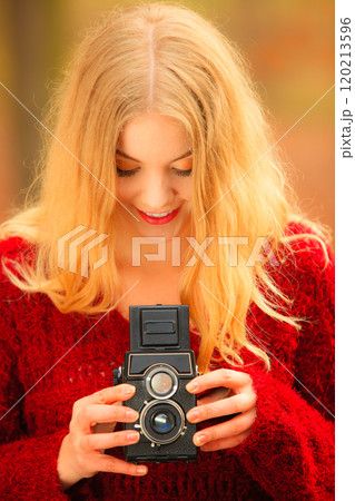 woman with old camera outdoor woman with old camera outdoor 120213596