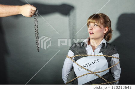 Upset businesswoman bound by contract terms. Upset businesswoman bound by contract terms. 120213642