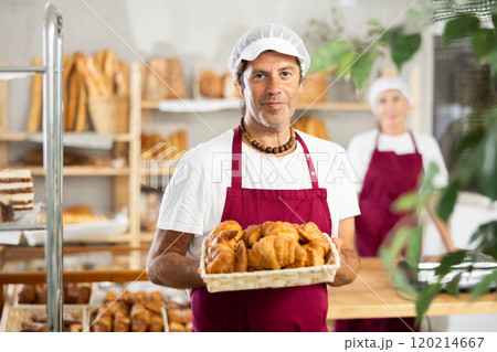 Man seller of bakery store is standing in trading floor, waiting for visitors 120214667