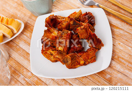 Appetizing delicious fried pork ribs on plate. Nutritious lunch Appetizing delicious fried pork ribs on plate. Nutritious lunch 120215111