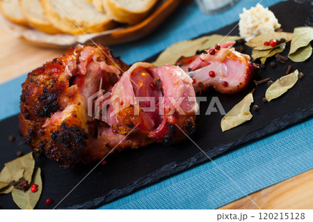 Roast pork knuckle with pepper and bay leaf 120215128