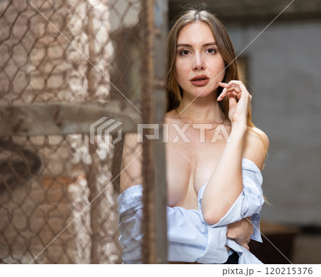 Tempting woman posing in derelict house 120215376