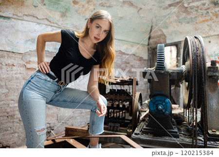 Attractive woman posing in industrial building 120215384