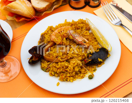 Traditional Spanish paella with seafood and chicken. Traditional Spanish paella with seafood and chicken. 120215408