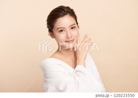 Beautiful young asian woman with clean fresh skin on beige background, Face care, Facial treatment, Cosmetology, beauty and spa, Asian women portrait. Beautiful young asian woman with clean fresh skin on beige background, Face care, Facial treatment, Cosmetology, beauty and spa, Asian women portrait. 120215550