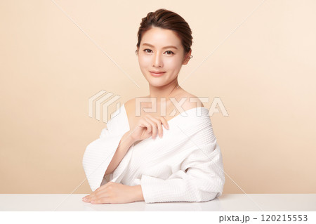 Beautiful young asian woman with clean fresh skin on beige background, Face care, Facial treatment, Cosmetology, beauty and spa, Asian women portrait. 120215553