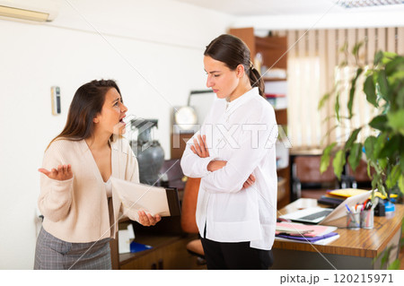 Unhappy woman chief screaming to young female manager Unhappy woman chief screaming to young female manager 120215971