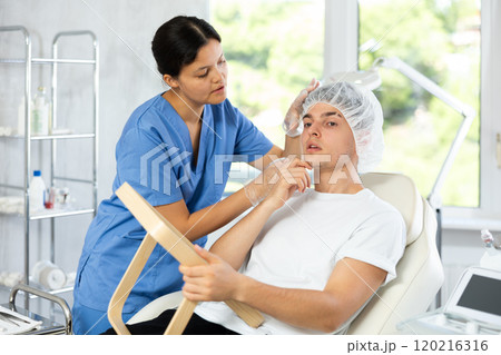 Patient eagerly looked into the mirror Patient eagerly looked into the mirror 120216316