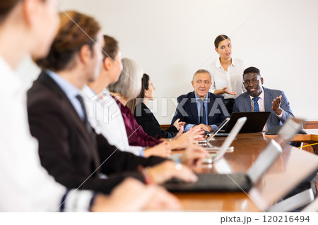 Executive team holding corporate meeting at office with assistance secretary's support Executive team holding corporate meeting at office with assistance secretary's support 120216494
