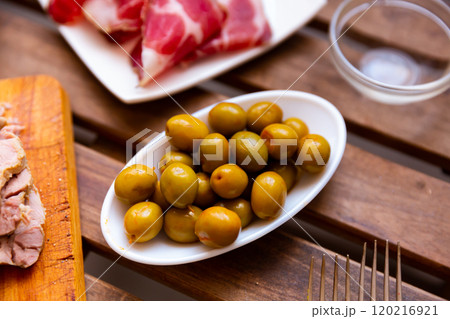 Pickled green olives with a stone 120216921