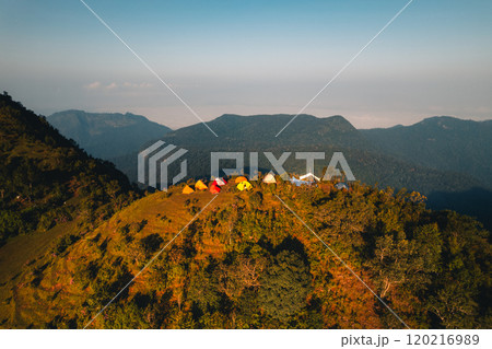 Aerial view of a tent in a grassland on a mountain. 120216989