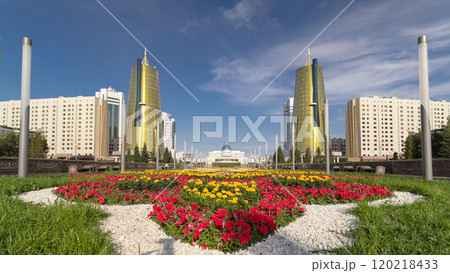 A square in front of Ak Orda with Altyn Orda business center timelapse hyperlapse in the foreground. 120218433