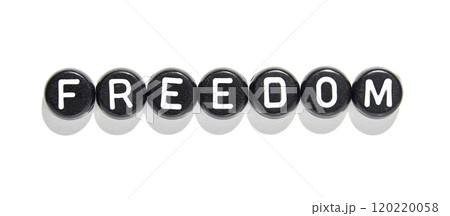 Freedom concept: black and white alphabet beads spelling 'freedom' against white Freedom concept: black and white alphabet beads spelling 'freedom' against white 120220058