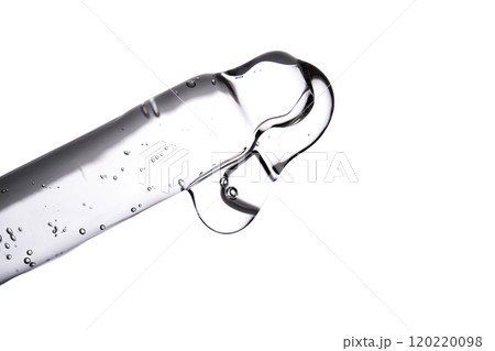 Dropper pipette with delicious serum with bubbles close-up. 120220098