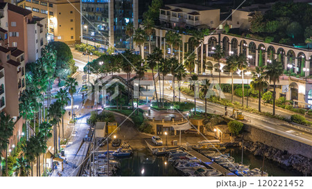 Fontvieille night timelapse - new district of Monaco. Boats, yachts in harbor and a high-rise apartment complex. 120221452