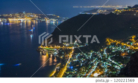 Night timelapse view of the Mediterranean coastline of the town of Eze village on the French Riviera 120221569