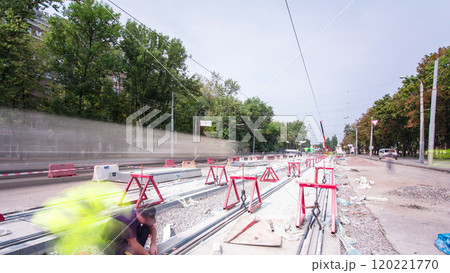 Road construction site with tram tracks repair and maintenance timelapse. Road construction site with tram tracks repair and maintenance timelapse. 120221770