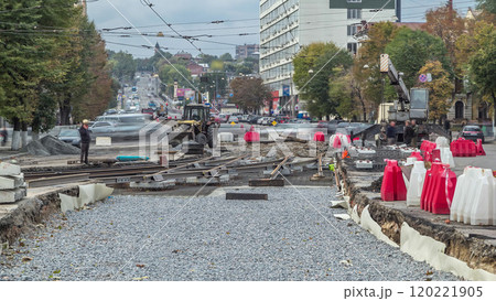 Repair works on the street timelapse. Laying of new tram rails on a city street. 120221905