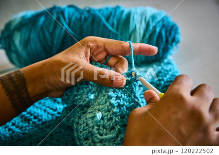 Hands Crocheting Vibrant Yarn with Tattoo Detail Close-Up Hands Crocheting Vibrant Yarn with Tattoo Detail Close-Up 120222502