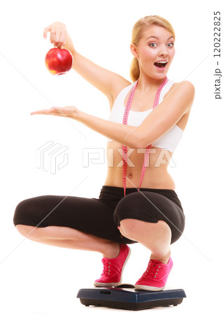 Happy woman weighing scale. Healthy nutrition . 120222825