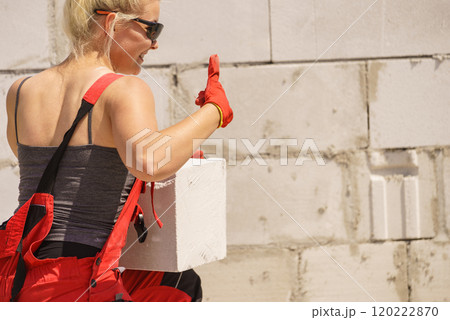 Woman working with airbricks 120222870