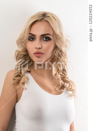 Sexy blonde in white top and pants portrait Sexy blonde in white top and pants portrait 120224052