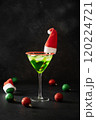 Xmas Grinch Punch in glass decorated sugar rim on black table make of cool lime sherbet. Tasty drink for Christmas holiday. Rim your festive beverages in red sugar. 120224721
